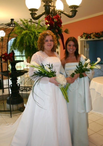 Bride and bridesmaid in Falcon Rest Mansion's piazza, wedding venue in Tennessee