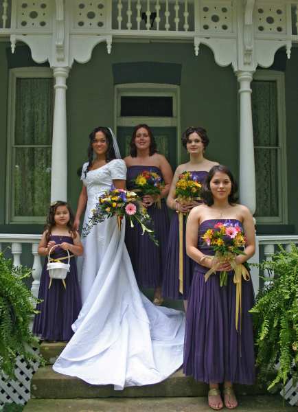 Bride and bridesmaids on veranda at Falcon Restedding venue between Nashville and Chattanooga