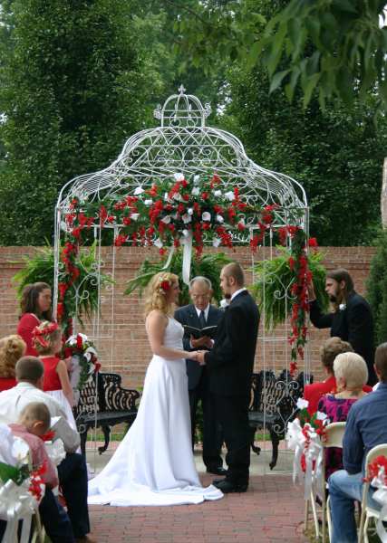Gazebo wedding ceremony in courtyard at Falcon Rest Mansion